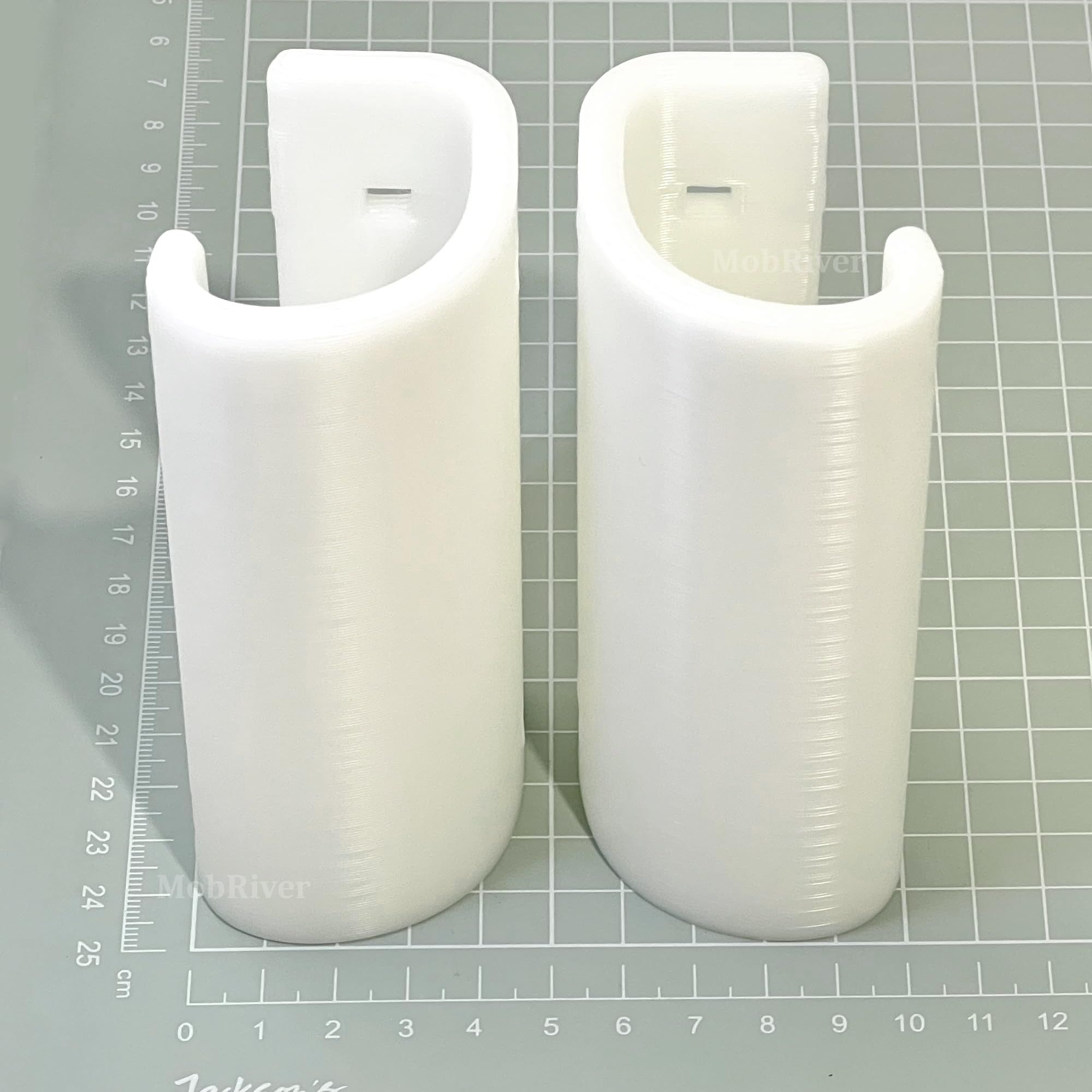 Two Mobriver Yardmaster shed door handles shown upright on a centimetre measuring mat